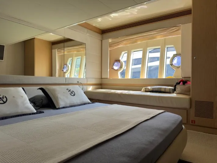  Yacht Photos Pics Luxurious bedroom interior of 2011 Ferretti Yachts 570 with elegant bedding and large windows.
