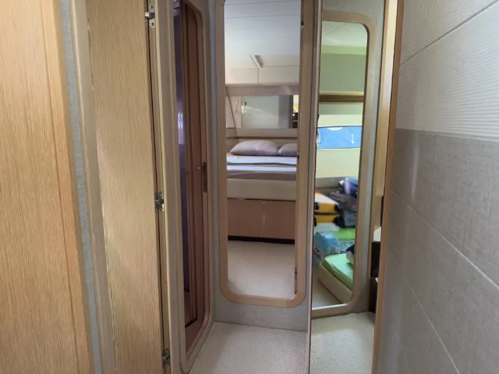  Yacht Photos Pics Interior of 2011 Ferretti Yachts 570, featuring a cozy bedroom with modern design.