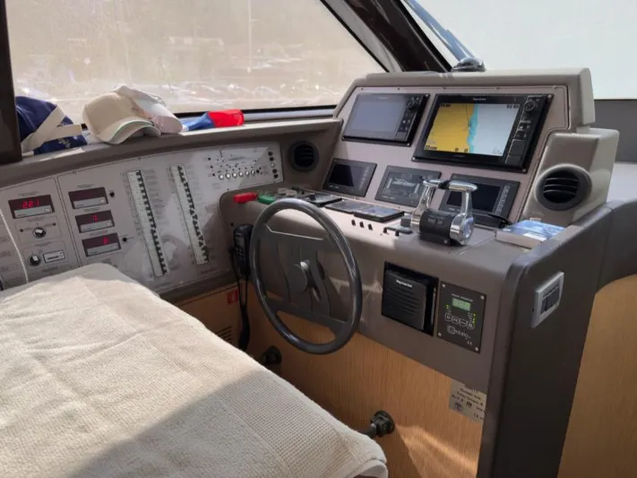  Yacht Photos Pics Cockpit of 2011 Ferretti Yachts 570 with navigation equipment and steering wheel.