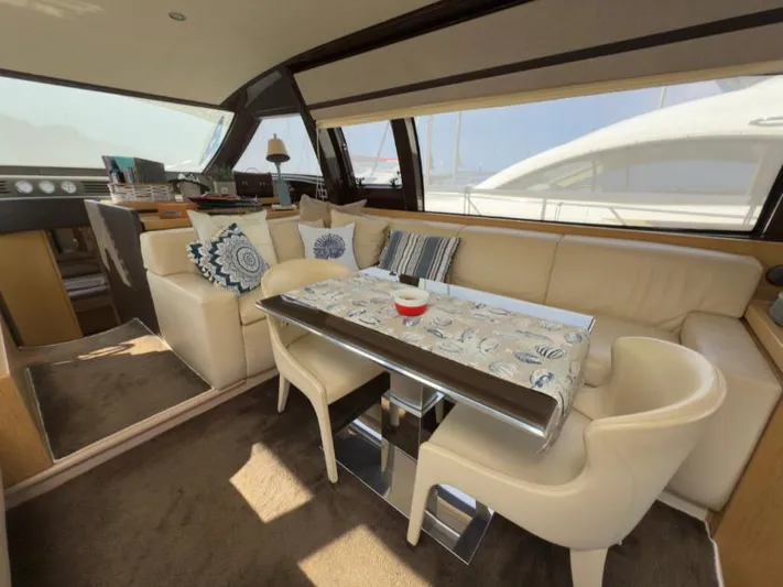  Yacht Photos Pics Luxurious interior of 2011 Ferretti Yachts 570 with elegant seating and decor.