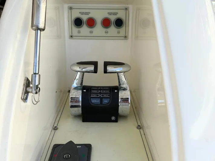  Yacht Photos Pics Control panel of a 2011 Ferretti Yachts 570, featuring throttle levers and buttons.