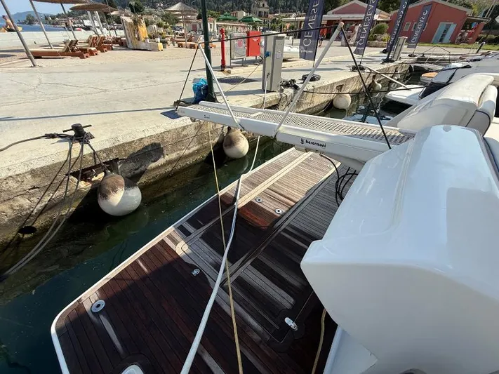  Yacht Photos Pics Ferretti Yachts 570, 2011 model, docked with wooden deck and marina view.