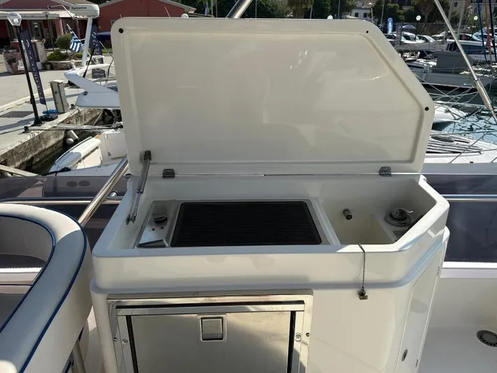  Yacht Photos Pics Outdoor grill station on 2011 Ferretti Yachts 570, docked at marina.