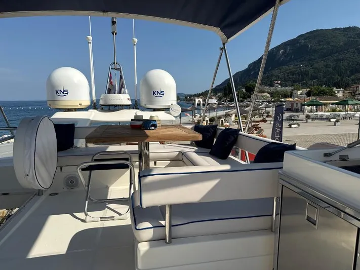  Yacht Photos Pics Luxurious 2011 Ferretti Yachts 570 with elegant seating and scenic coastal view.