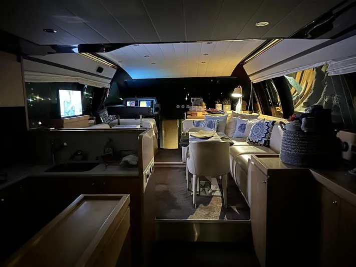  Yacht Photos Pics Luxurious interior of a 2011 Ferretti Yachts 570, featuring elegant seating and ambient lighting.
