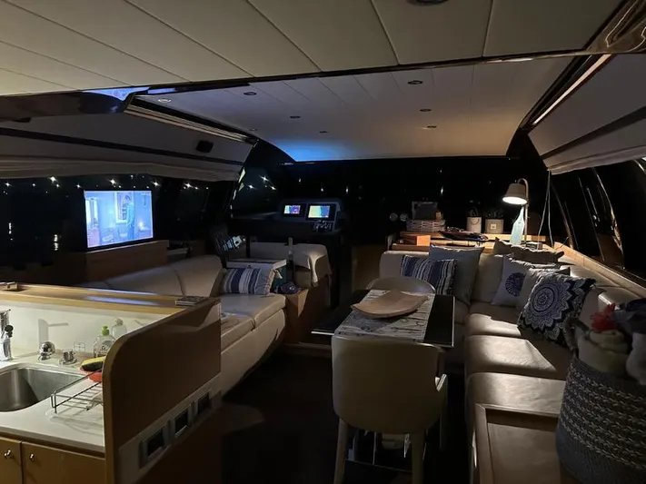  Yacht Photos Pics Luxurious interior of a 2011 Ferretti Yachts 570, featuring elegant seating and modern amenities.