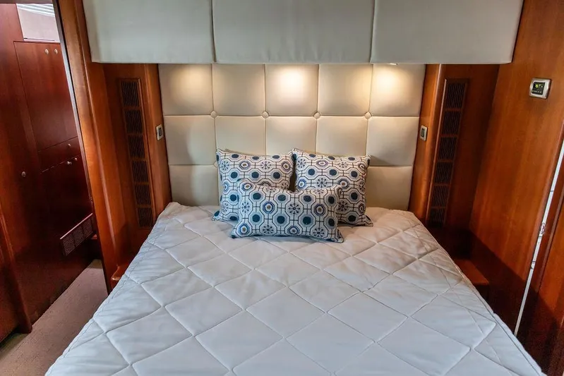 Marina Yacht Photos Pics Luxurious bedroom interior of 2008 Huckins Linwood yacht with elegant bedding and cushions.