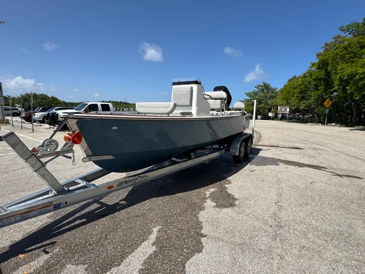  Yacht Photos Pics 2024 Dragonfly 21 Spanish Wells boat on trailer in sunny parking lot.