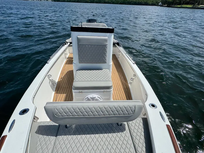  Yacht Photos Pics 2024 Dragonfly 21 Spanish Wells boat interior with quilted seating on open water.