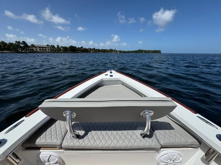  Yacht Photos Pics Bow view of 2024 Dragonfly 21 Spanish Wells boat on open water.