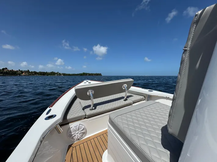  Yacht Photos Pics 2024 Dragonfly 21 Spanish Wells boat interior with cushioned seating on open water.