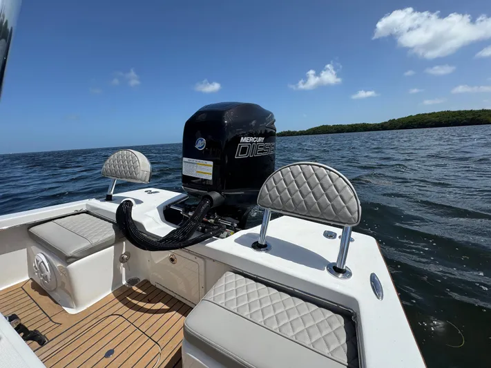  Yacht Photos Pics 2024 Dragonfly 21 Spanish Wells boat with Mercury Diesel engine on open water.