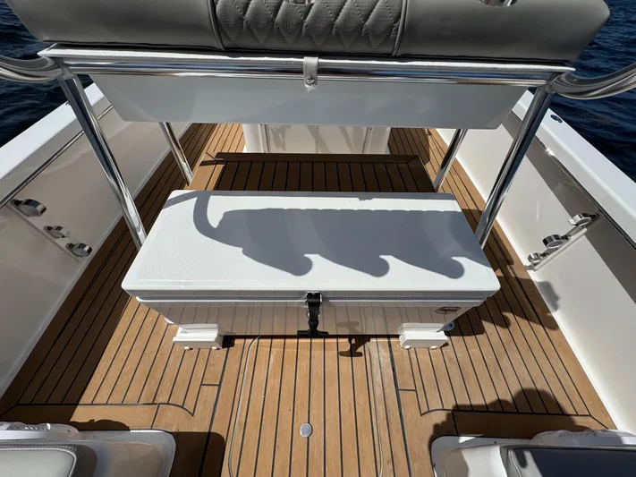  Yacht Photos Pics 2024 Dragonfly 21 Spanish Wells boat interior with wooden deck and seating.
