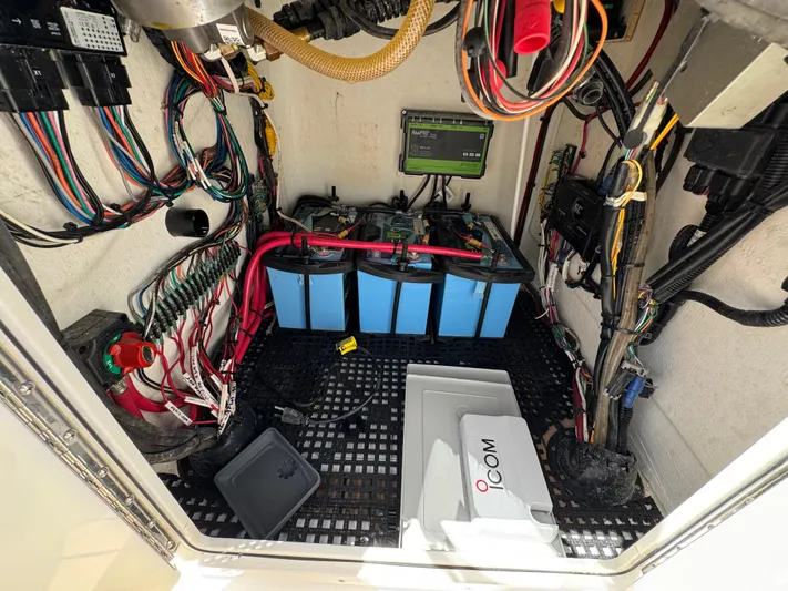  Yacht Photos Pics Electrical compartment of 2024 Dragonfly 21 Spanish Wells boat with batteries and wiring.