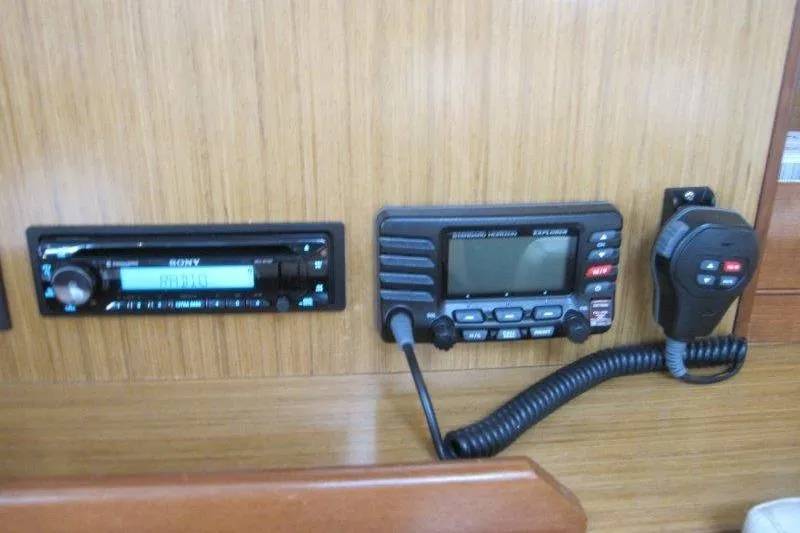 Angelucia Yacht Photos Pics Control panel of a 2008 Jeanneau Sun Odyssey 39i yacht with radio and communication equipment.