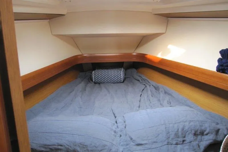 Angelucia Yacht Photos Pics Cozy cabin interior of 2008 Jeanneau Sun Odyssey 39i sailboat with comfortable bedding.