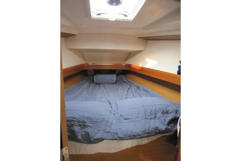 Angelucia Yacht Photos Pics Cozy cabin interior of 2008 Jeanneau Sun Odyssey 39i sailboat with bed and skylight.