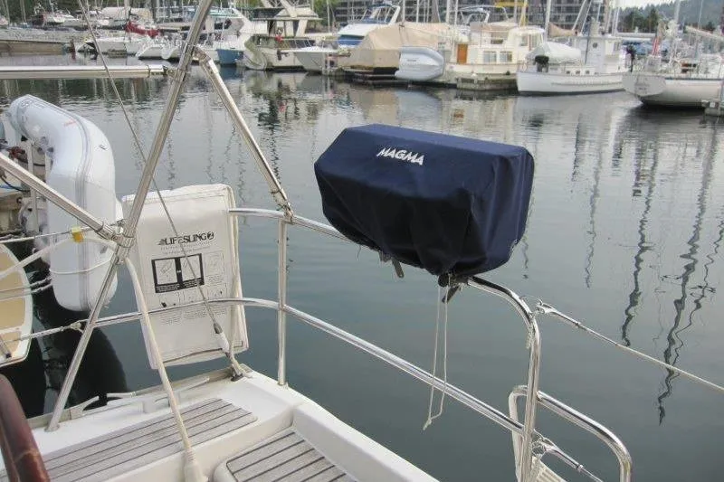 Angelucia Yacht Photos Pics 2008 Jeanneau Sun Odyssey 39i yacht with Magma grill, docked in marina.