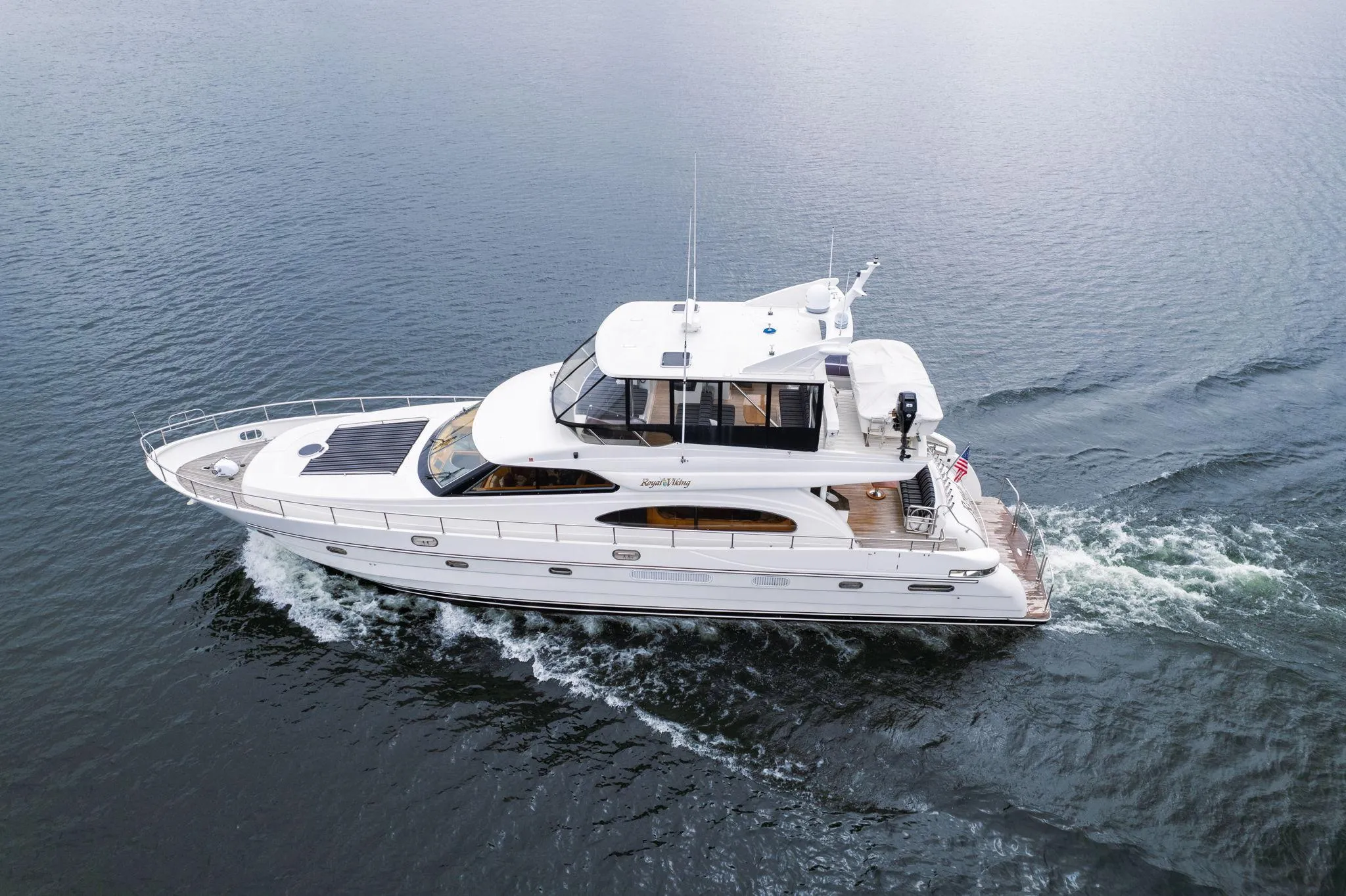 1999 Vitech 68' Pilothouse yacht cruising on open water.