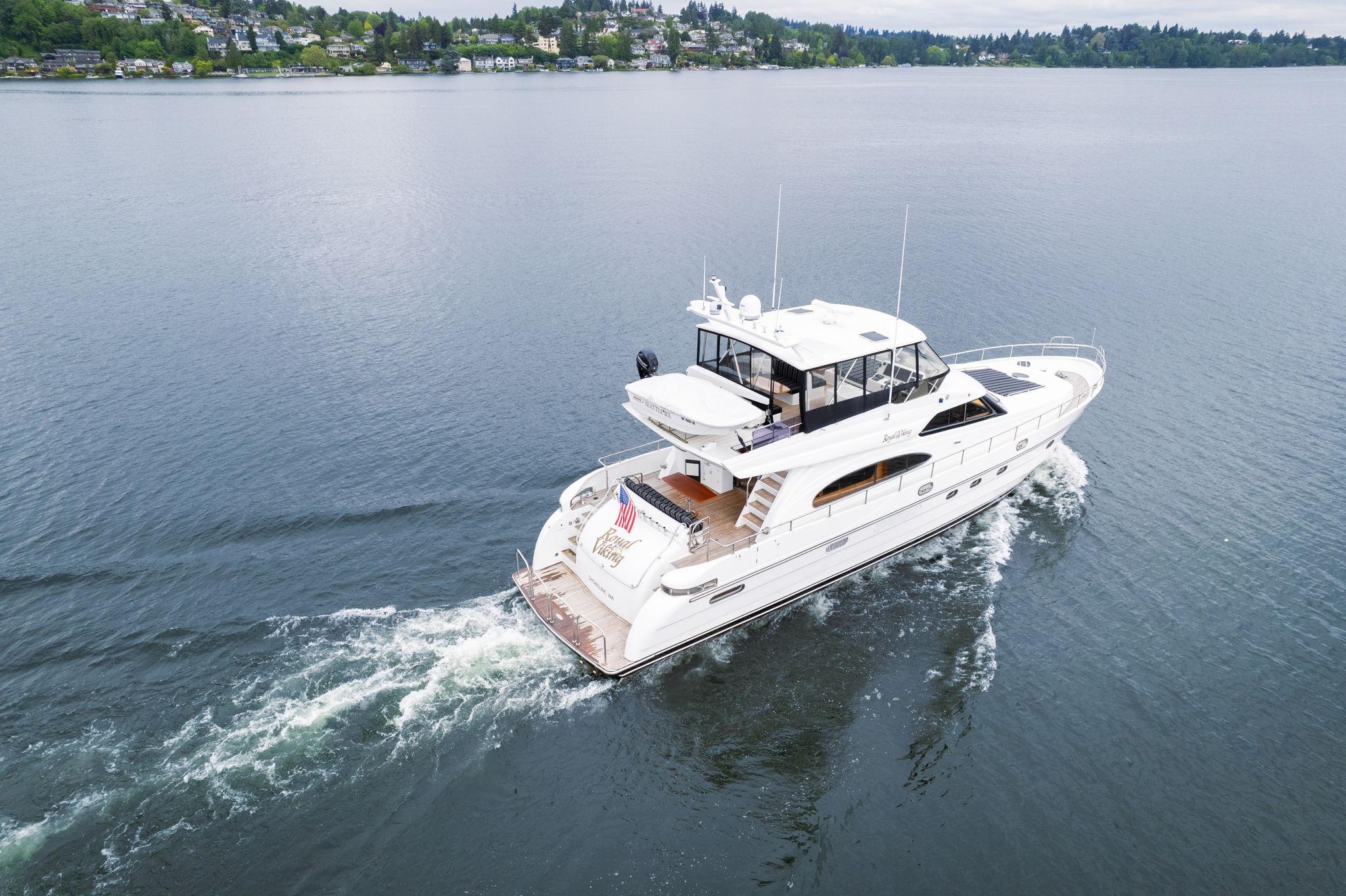 1999 Vitech 68' Pilothouse yacht cruising on a calm lake.