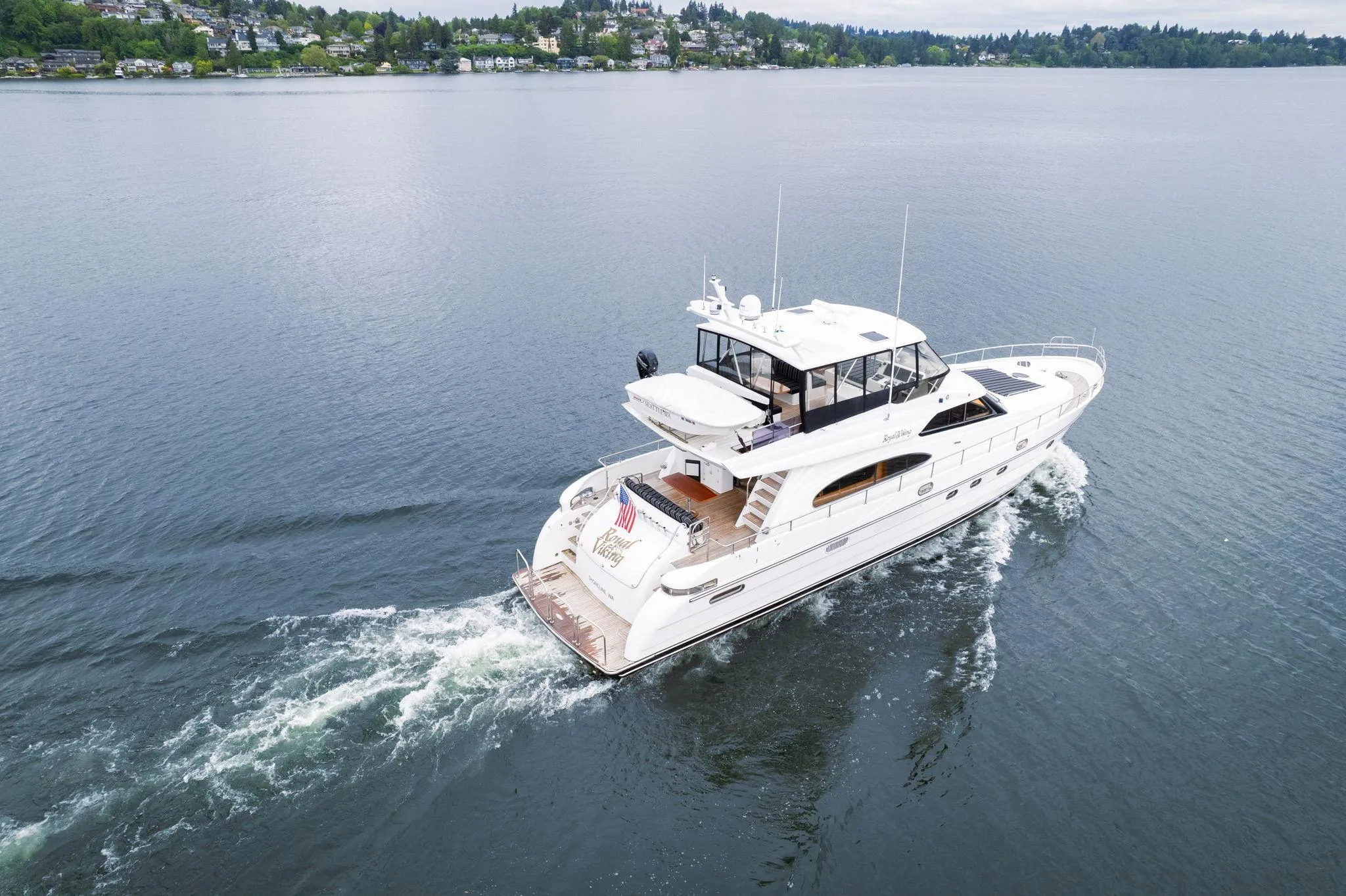 1999 Vitech 68' Pilothouse yacht cruising on a calm lake.