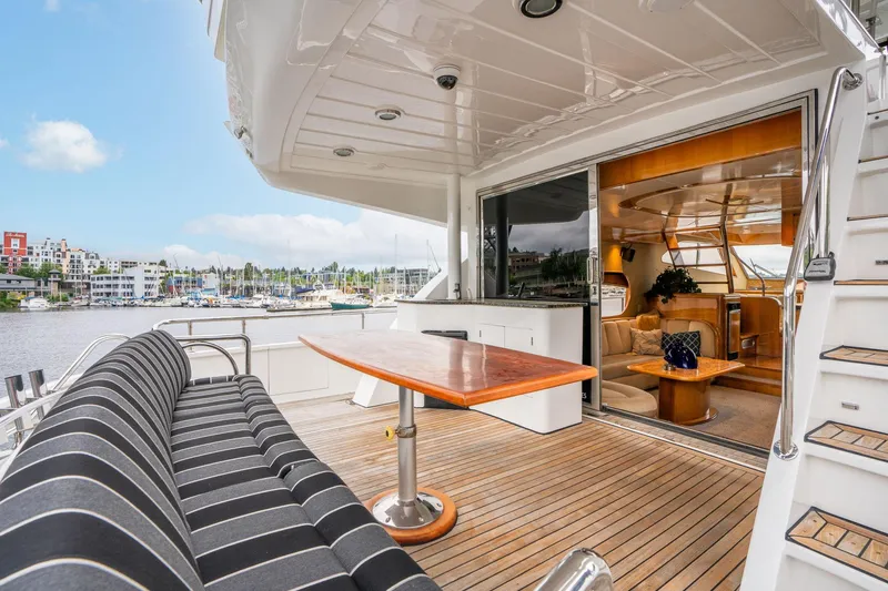 Royal Viking Yacht Photos Pics 1999 Vitech 68' Pilothouse yacht with elegant deck seating and marina view.