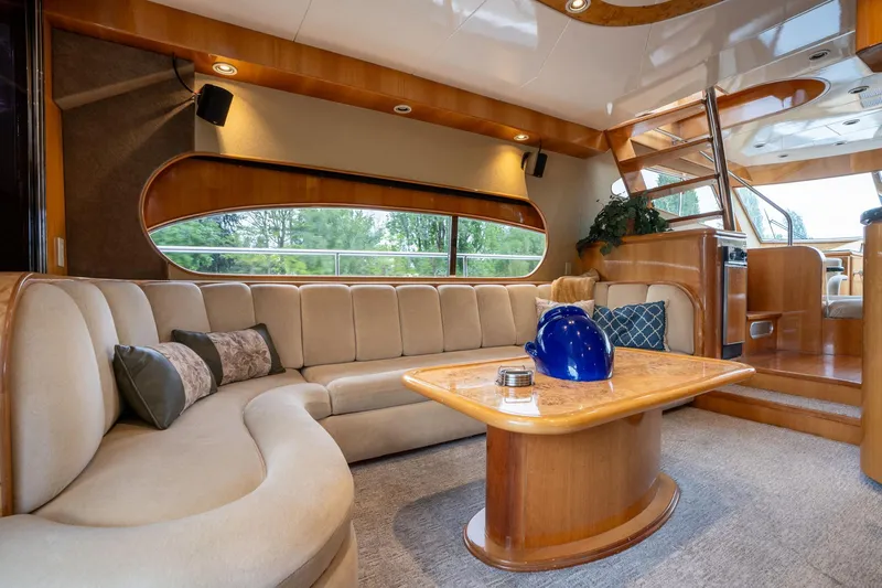 Royal Viking Yacht Photos Pics Luxurious interior of 1999 Vitech 68' Pilothouse yacht with elegant seating and wooden accents.