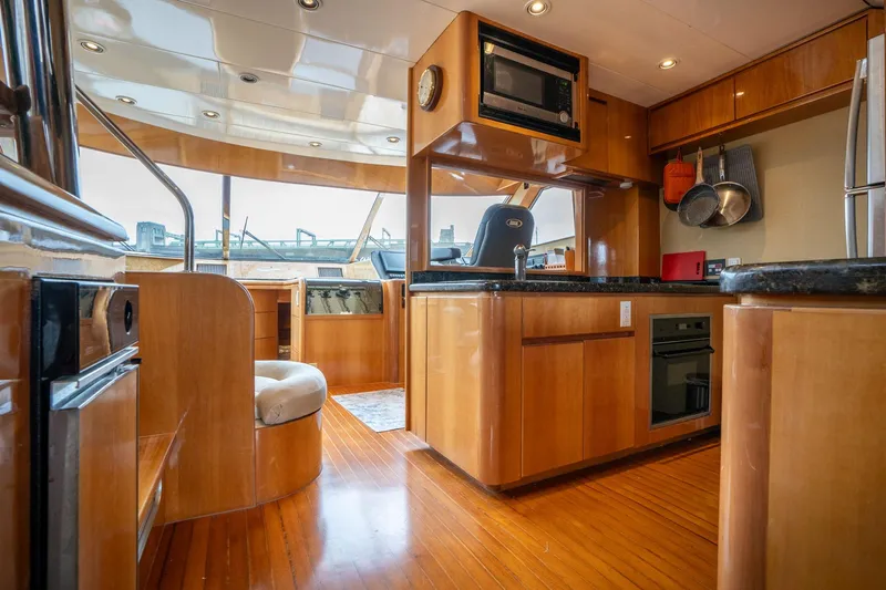 Royal Viking Yacht Photos Pics Luxurious interior of 1999 Vitech 68' Pilothouse yacht with modern kitchen amenities.