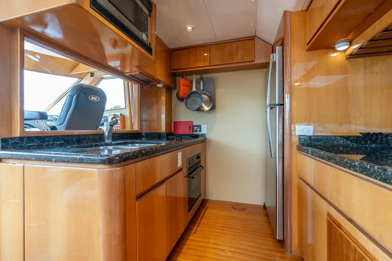 Royal Viking Yacht Photos Pics Luxurious kitchen interior of 1999 Vitech 68' Pilothouse yacht with modern appliances.