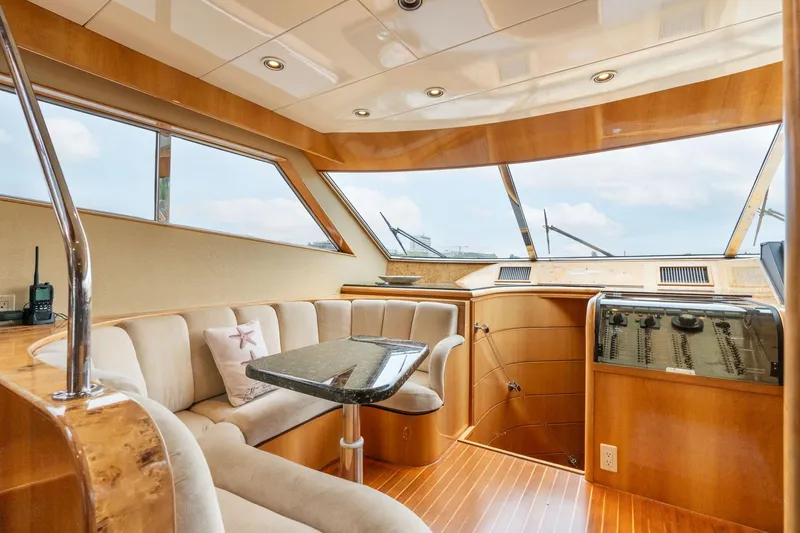 Royal Viking Yacht Photos Pics Luxurious interior of 1999 Vitech 68' Pilothouse yacht with plush seating and elegant wood finishes.