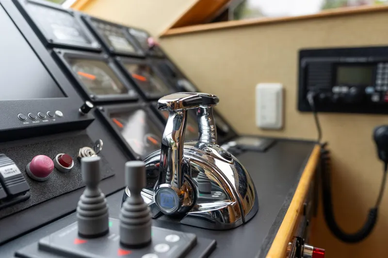 Royal Viking Yacht Photos Pics Control panel of a 1999 Vitech 68' Pilothouse yacht, featuring navigation instruments and controls.