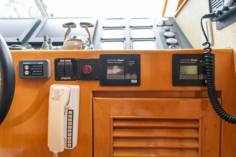 Royal Viking Yacht Photos Pics Control panel of 1999 Vitech 68' Pilothouse yacht with communication devices and gauges.