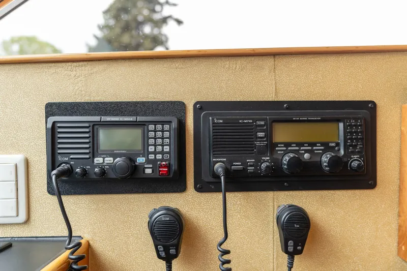 Royal Viking Yacht Photos Pics Control panel of 1999 Vitech 68' Pilothouse with communication radios and microphones.
