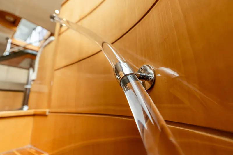 Royal Viking Yacht Photos Pics Elegant wooden interior of 1999 Vitech 68' Pilothouse yacht with sleek handrail design.