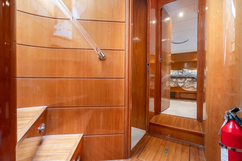 Royal Viking Yacht Photos Pics Interior of 1999 Vitech 68' Pilothouse yacht with wooden stairs and hallway.