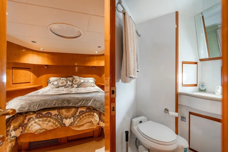 Royal Viking Yacht Photos Pics Luxurious bedroom and bathroom in 1999 Vitech 68' Pilothouse yacht.