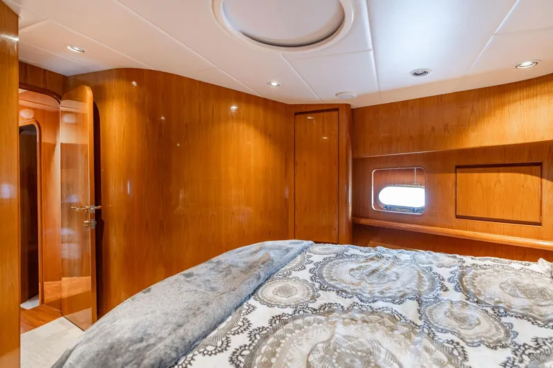 Royal Viking Yacht Photos Pics Luxurious cabin interior of 1999 Vitech 68' Pilothouse yacht with elegant wood paneling.
