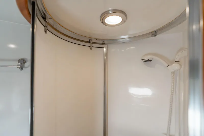 Royal Viking Yacht Photos Pics Shower area in 1999 Vitech 68' Pilothouse yacht, featuring modern fixtures and lighting.