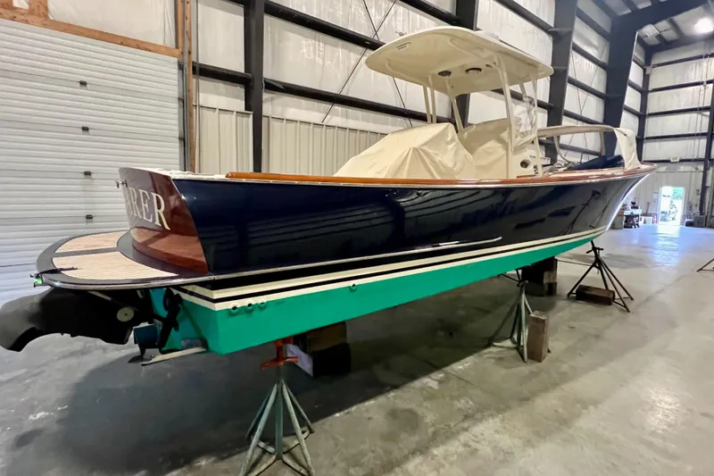 Wayfarer Yacht Photos Pics 2002 Hinckley Talaria 29C boat in storage, side view, blue and green hull.