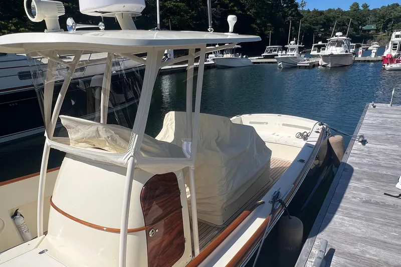 Wayfarer Yacht Photos Pics 2002 Hinckley Talaria 29C docked at a marina, featuring a covered helm.