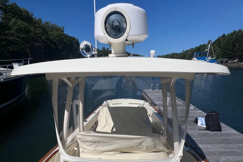 Wayfarer Yacht Photos Pics 2002 Hinckley Talaria 29C boat docked, featuring a covered helm and radar equipment.