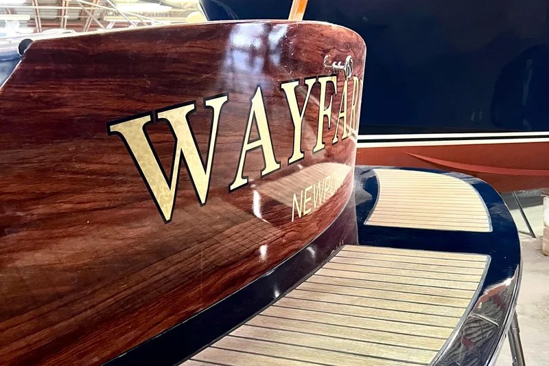 Wayfarer Yacht Photos Pics Hinckley Talaria 29C 2002 boat with "Wayfarer" name, wooden finish, and elegant design.