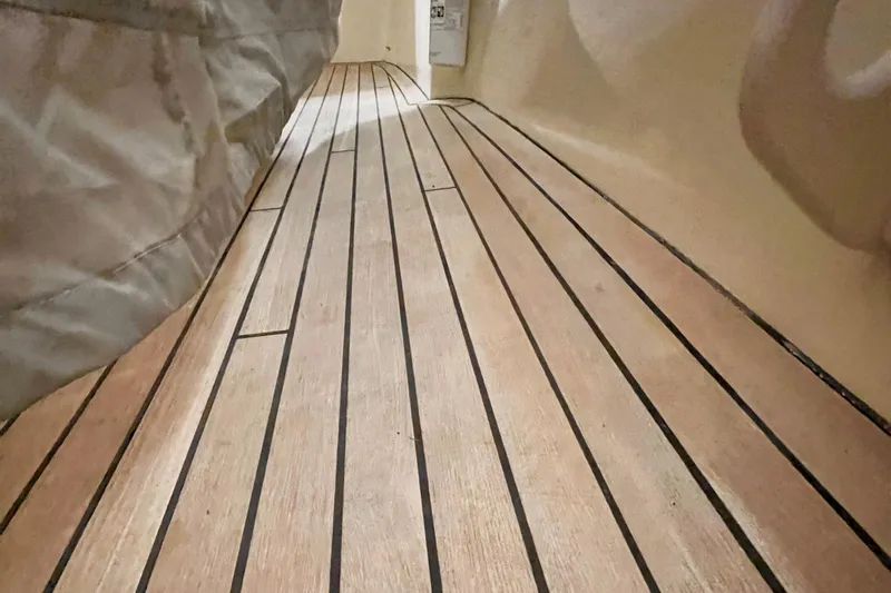 Wayfarer Yacht Photos Pics Teak deck of 2002 Hinckley Talaria 29C boat, showcasing elegant wood finish.