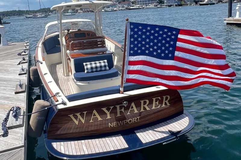 Wayfarer Yacht Photos Pics 2002 Hinckley Talaria 29C boat docked, displaying American flag, named "Wayfarer" in Newport.