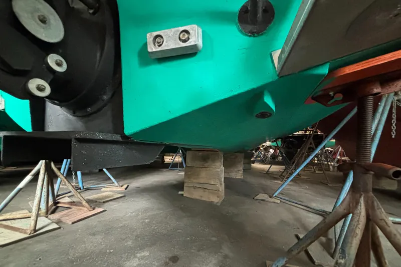 Wayfarer Yacht Photos Pics 2002 Hinckley Talaria 29C boat hull on stands in a workshop.