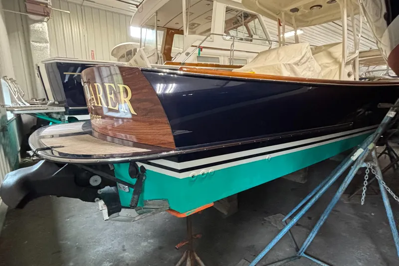 Wayfarer Yacht Photos Pics 2002 Hinckley Talaria 29C boat in storage, showcasing elegant design and craftsmanship.