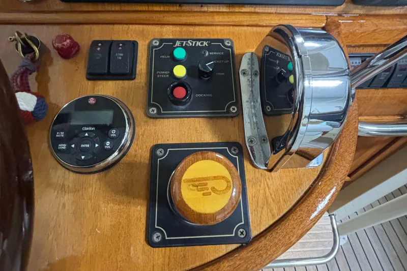 Wayfarer Yacht Photos Pics Control panel of a 2002 Hinckley Talaria 29C boat with various switches and dials.