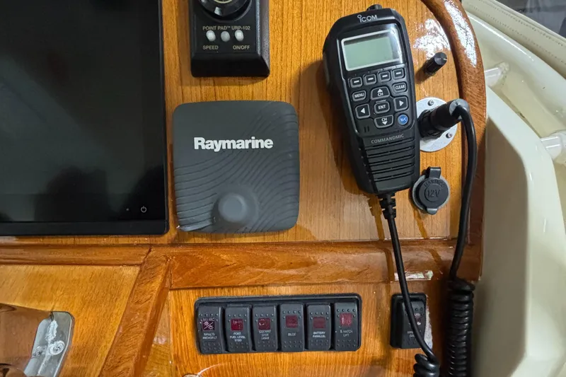Wayfarer Yacht Photos Pics Control panel of a 2002 Hinckley Talaria 29C with Raymarine and marine radio equipment.