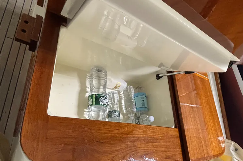 Wayfarer Yacht Photos Pics Open storage compartment on 2002 Hinckley Talaria 29C with water bottles inside.