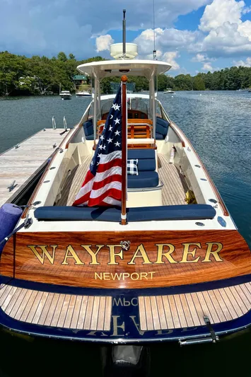 Wayfarer Yacht Photos Pics 2002 Hinckley Talaria 29C boat named "Wayfarer" docked, featuring an American flag.